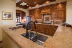 This custom kitchen is one you have to see to believe and is stocked for the gourmet chef.